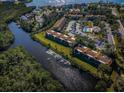 Aerial view of complex with river, docks, and community pool, showcasing waterfront living at 1686 Seascape Cir, Tarpon Springs, FL 34689