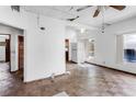 Open living room with wood floors, kitchen access, and abundant natural light at 1778 27Th N Ave, St Petersburg, FL 33713