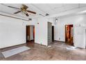 Spacious living room with wood floors, multiple doors, and a unique glass block feature at 1778 27Th N Ave, St Petersburg, FL 33713