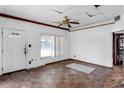 Bright living room featuring textured walls, parquet floors, and natural light from a large window at 1778 27Th N Ave, St Petersburg, FL 33713