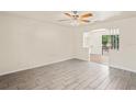 Bright living room showcasing modern tile flooring and an open design with natural light at 2207 Valleybrook Ave, Valrico, FL 33594