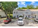 An exterior view showcases the well-maintained townhomes and convenient parking at 2418 Lake Woodberry Cir, Brandon, FL 33510