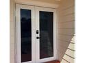 Close-up of the front door with secure digital lock at 3301 Clydesdale Dr, Holiday, FL 34691
