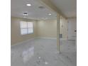 Spacious living room with recessed lighting and marble flooring at 3301 Clydesdale Dr, Holiday, FL 34691