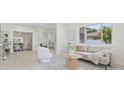 Bright and airy living room with modern furnishings, large windows, and neutral decor at 504 N Habana Ave, Tampa, FL 33609