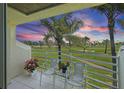 Enjoy the views from this charming balcony with tile floors and seating, overlooking the community golf course at 6191 Bahia Del Mar Blvd # 204, St Petersburg, FL 33715