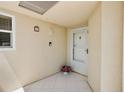 Cozy condo entrance with tile floor and security system, plus a flower pot for a touch of greenery at 6191 Bahia Del Mar Blvd # 204, St Petersburg, FL 33715