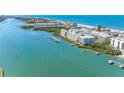Beautiful waterfront condos with boat docks, white sand beach and blue skies at 19925 Gulf Blvd # 402, Indian Shores, FL 33785