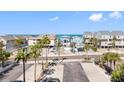 Charming beach community with colorful houses and swaying palm trees at 19925 Gulf Blvd # 402, Indian Shores, FL 33785