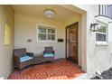 Charming front porch featuring comfortable seating, and tile flooring, creating an inviting entryway at 2700 Bayshore Blvd # 522, Dunedin, FL 34698