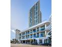 Striking building with sleek architectural design and glass balconies offering water views at 301 1St S St # 3004, St Petersburg, FL 33701