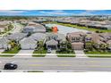 Aerial view of a lovely single-Gathering home in a lakeside community at 3096 Great Banyan Way, Wesley Chapel, FL 33543