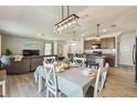 Open concept living and dining area with modern decor, and great natural light at 32721 Brooks Hawk Ln, Wesley Chapel, FL 33543