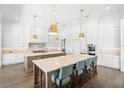 Spacious, bright kitchen with an eat in island, marble countertops, stainless steel appliances and ample storage at 5142 W San Jose St, Tampa, FL 33629