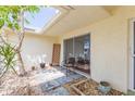 Cozy covered patio area with stone pavers and easy access to the interior living space at 5421 Orange Blossom N Rd, Pinellas Park, FL 33782