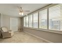 Sun room with tile flooring, natural light, and cozy seating, creating a perfect relaxation spot at 5575 Gulf Blvd # 329, St Pete Beach, FL 33706