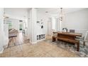 Open foyer with tile flooring, storage, and a view of the living and dining areas at 7207 Forest Mere Dr, Riverview, FL 33578