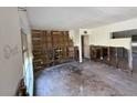 Spacious living room with exposed framework, ready for renovations to create a custom living space at 7365 Royal Palm Dr, New Port Richey, FL 34652