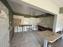 Renovation project kitchen features white cabinets with great potential for customization at 7366 Royal Palm Dr, New Port Richey, FL 34652