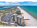 Scenic aerial view of waterfront condo with beach access and vast parking area at 880 Mandalay Ave # N710, Clearwater Beach, FL 33767
