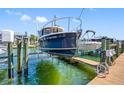 Boat dock featuring a boat lift, showcasing waterfront living and the convenience of boat storage at 0 Beach Se Dr # 162Ss, St Petersburg, FL 33705