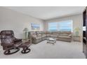 Inviting living room featuring comfortable seating, an ocean view, and neutral colors creating a cozy atmosphere at 1270 Gulf Blvd # 1904, Clearwater Beach, FL 33767