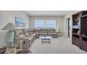 Spacious living room with a comfortable sectional, complemented by ocean views, creating a serene ambiance at 1270 Gulf Blvd # 1904, Clearwater Beach, FL 33767