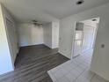 Bright living room featuring hardwood floors and fresh white paint at 12809 Wedgewood Way # A, Hudson, FL 34667