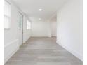 Bright living area featuring light gray flooring, white walls, and natural light at 1513 Escort Ave, Tampa, FL 33610