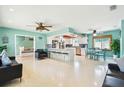 Spacious open-concept living room featuring modern design elements and abundant natural light at 18102 2Nd St E, Redington Shores, FL 33708