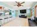Bright and airy living room showcasing a comfortable seating arrangement and open floor plan at 18102 2Nd St E, Redington Shores, FL 33708