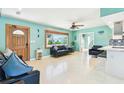 Inviting living room featuring stylish furnishings and an abundance of natural light at 18102 2Nd St E, Redington Shores, FL 33708