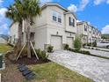 Charming two-story home with two-car garage, paved driveway, and inviting curb appeal at 19153 Elsimont Isle, Lutz, FL 33558