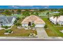 Well-maintained single-story home with tile roof, manicured lawn, and decorative stone accents at 2017 S Pebble Beach Blvd, Sun City Center, FL 33573