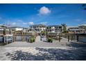 A view of a modern dock extending onto the waterway with lush landscaping and boats nearby at 2501 S Dundee St, Tampa, FL 33629
