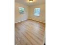 Comfortable bedroom with ample natural light, freshly painted and new floors at 3009 S Willow Dr, Plant City, FL 33566