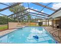Screened-in pool and spa area, perfect for outdoor relaxation and entertainment at 3014 Ashland Ter, Clearwater, FL 33761
