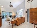 Bright living room featuring high ceilings and an abundance of natural light at 3182 Windmoor N Dr, Palm Harbor, FL 34685