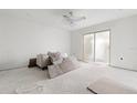 Bright, unfinished living room with a sliding door and materials for renovation at 343 S Mcmullen Booth Rd # 151, Clearwater, FL 33759