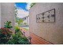 Landscaped walkway with red brick pavers leading to the entrance of this townhome at 4230 Hartwood Ln, Tampa, FL 33618
