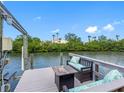 Enjoy relaxing on the private dock with comfortable seating and scenic water views at 4306 Sunray Ct, Tampa, FL 33615