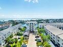 Breathtaking aerial view showcasing the waterfront condominium complex with lush landscaping and stunning bay views at 455 Pinellas Bayway S # 2B, Tierra Verde, FL 33715
