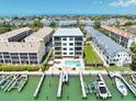 Stunning waterfront building with private boat docks, pool, and luxurious amenities in a coastal community at 455 Pinellas Bayway S # 4A, Tierra Verde, FL 33715