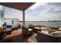 Covered patio with outdoor seating and beautiful waterfront view at 5129 Se Salmon Se Dr # A, St Petersburg, FL 33705