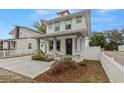 Charming two-story home boasting a covered porch, stone accents, and a well-manicured front yard at 5501 N 15Th St, Tampa, FL 33610