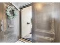 An open doorway showcasing an elegant wreath and secure entrance at 5559 Escondida S Blvd, St Petersburg, FL 33715