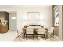Inviting dining room with natural light, modern decor, and seating for six at 11857 Sparkling Topaz Cv, Parrish, FL 34219