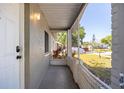 Inviting porch with views of the front yard and the surrounding neighborhood at 12597 Cumberland Dr, Largo, FL 33773