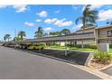 A covered parking area with designated parking spots for residents and guests at 135 Nina Way # 35, Oldsmar, FL 34677