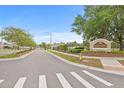 Inviting entrance to the Cambridge Place community with well-maintained landscaping and clear signage at 13675 Paddington Way, Spring Hill, FL 34609